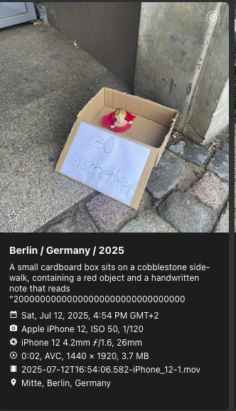 PhotoPrism showing a cardboard box on a sidewalk with a red toy and a “zu verschenken” note, captioned as a note reading a long number